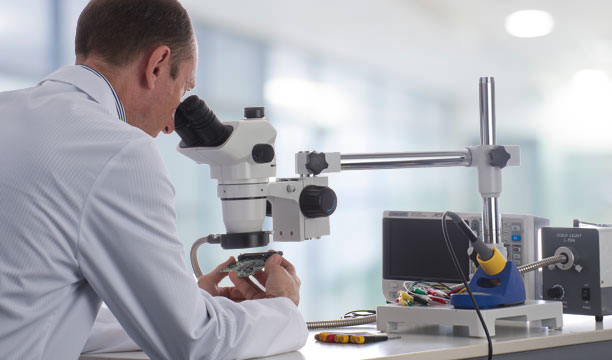 data recovery specialist with microscope