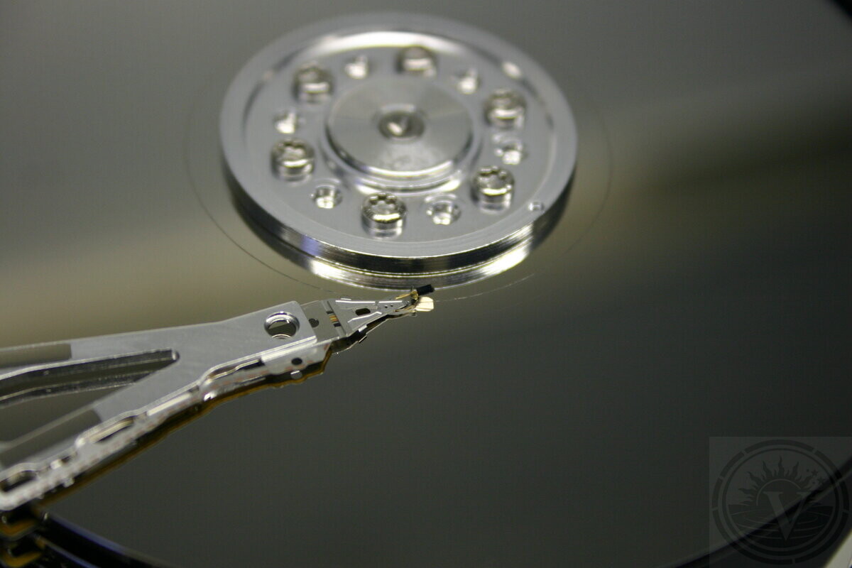 Data recovery specialist handling a hard drive in our laboratory