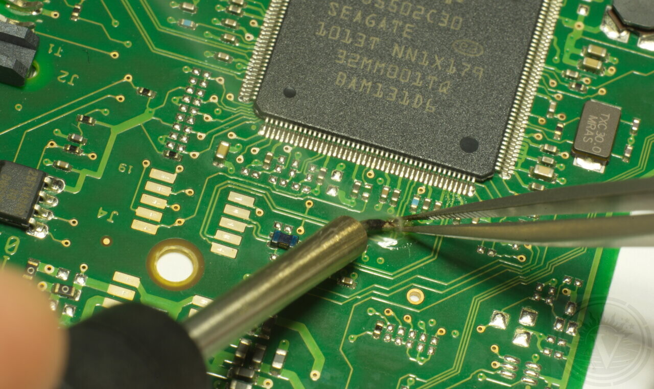 Data recovery specialist handling a hard drive in our laboratory