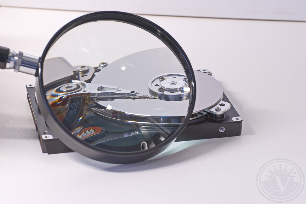 Data recovery specialist handling a hard drive in our laboratory